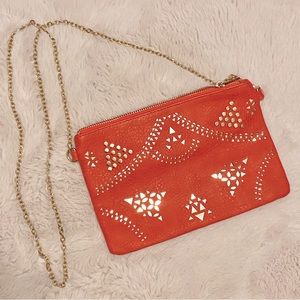 Red and gold studded purse with chain strap